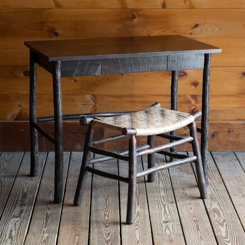 36" Rough-Sawn Dark Pine & Hickory Writing Desk with Dovetail Drawer, Angled Front View with Camp Stool