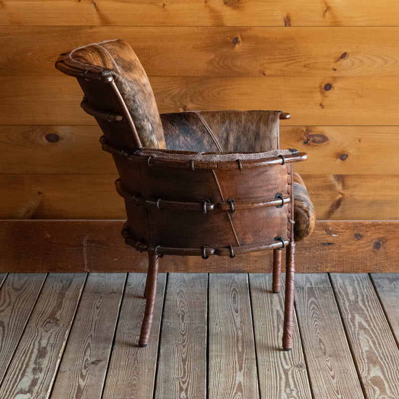 Rustic Black and Brown Brindle Hair-on-Hide Leather Chair with Ribbed Back, Profile View