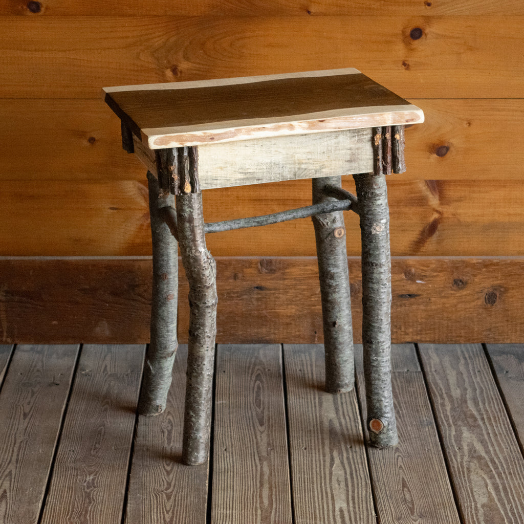 Rustic Accent Table with Walnut-Stained Center and Twig Decoration, Angled Front View