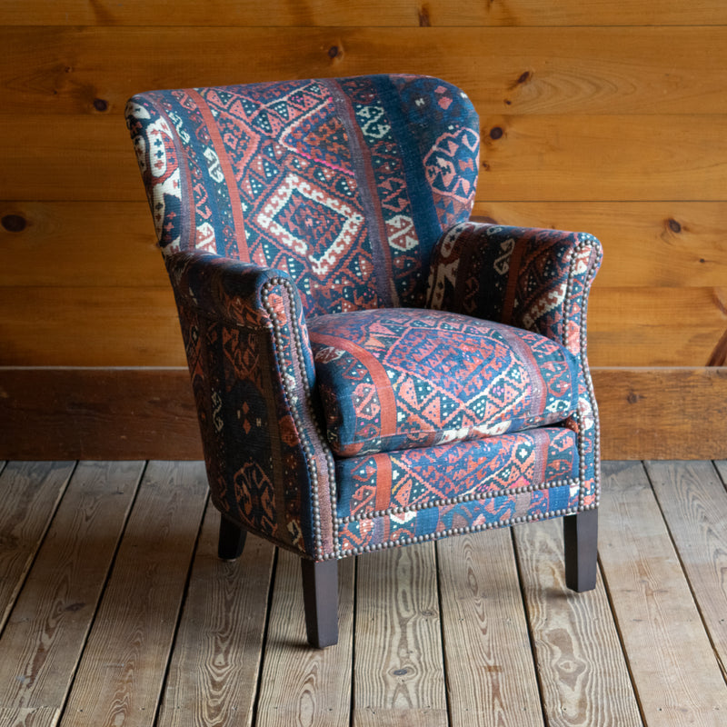 Petite Tightback Armchair Upholstered in Blue, Red, and Pink Abstract Kilim Fabric, Angled Front View