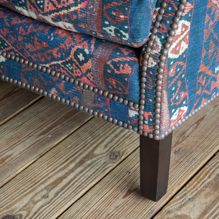 Petite Tightback Armchair Upholstered in Blue, Red, and Pink Abstract Kilim Fabric, Leg Detail