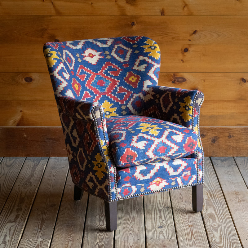 Petite Tightback Armchair Upholstered in Blue, Red, and Yellow Kilim Fabric, Angled Front View