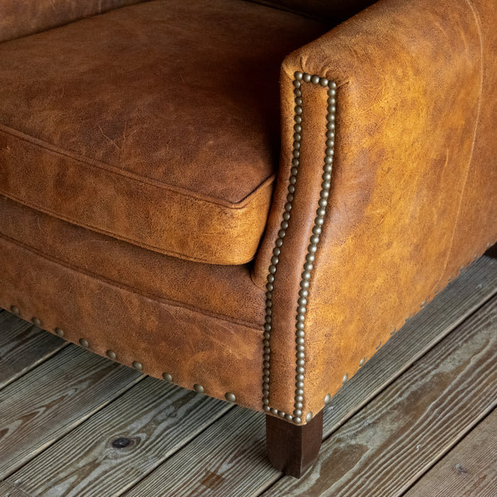 Rustic Distressed Brown Leather Lounge Chair with Nailhead Trim, Arm Detail