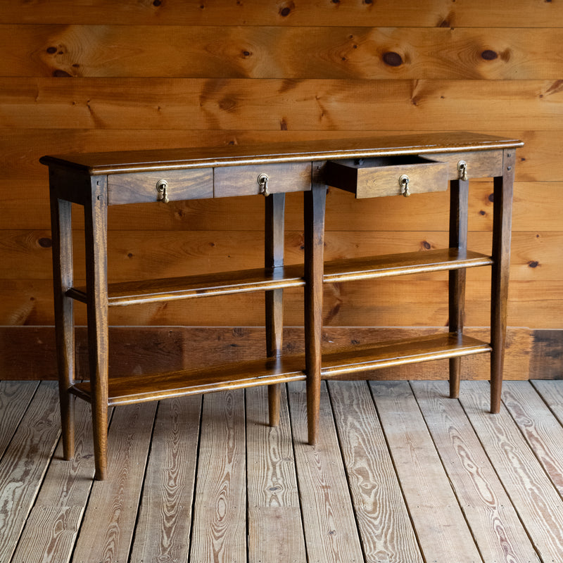 Rustic Narrow Entryway Table with Four Drawers and Full-Length Shelves, Angled Front View with Open Drawer