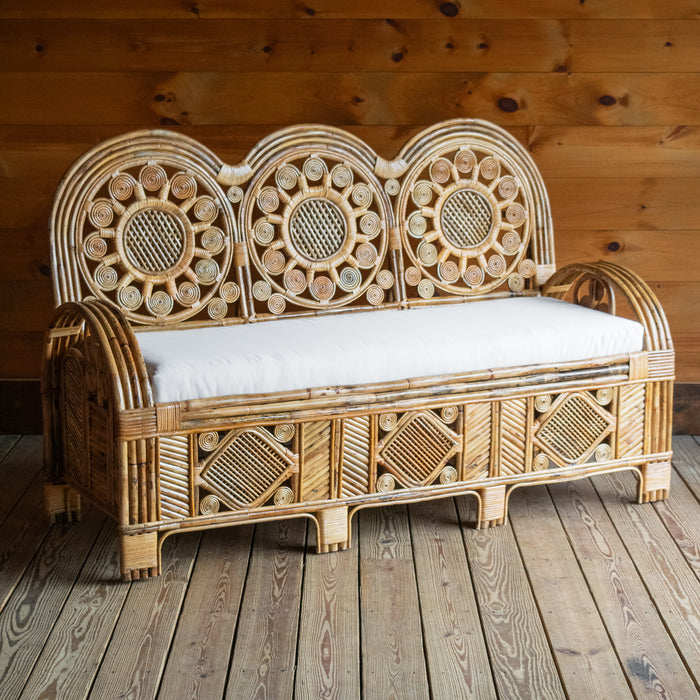 Handcrafted Rattan Sofa with Sunflower Details and Off-White Sunbrella Bench Seat Cushion, Angled Front View