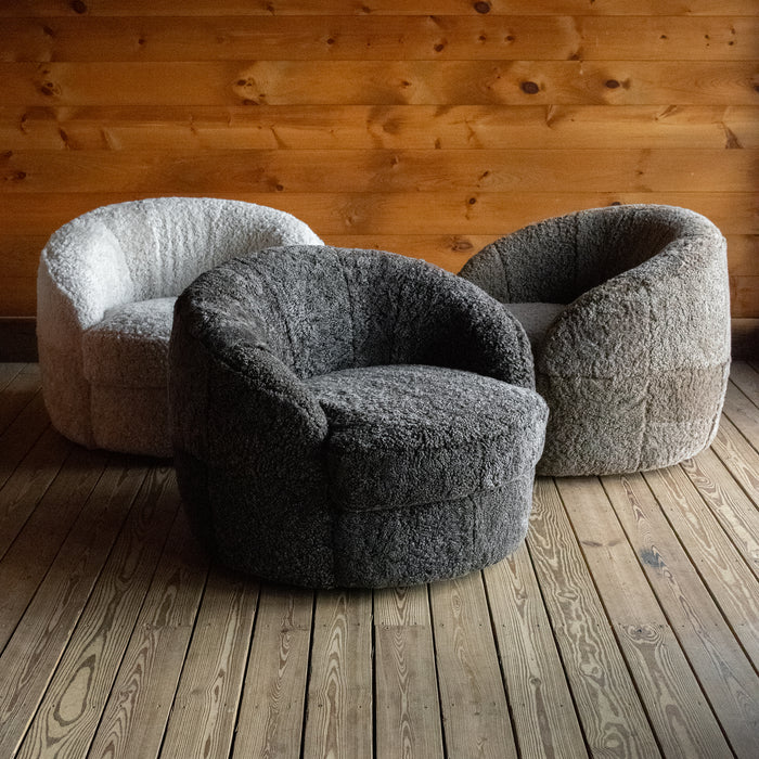 Three Sheepskin Swivel Chairs in the Colors Cream, Charcoal, and Brown, Group View